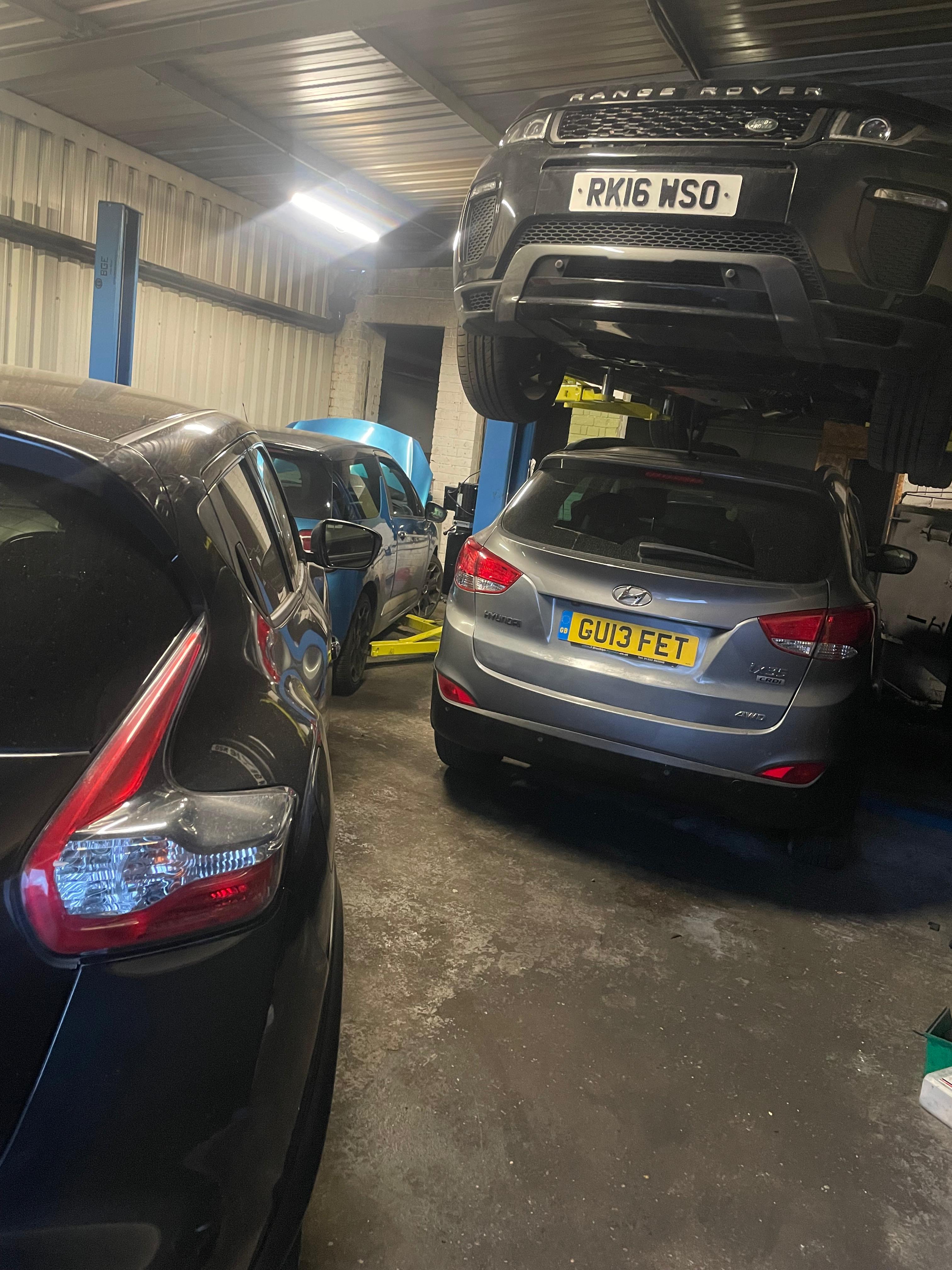 Mechanic performing a full car service in Willenhall